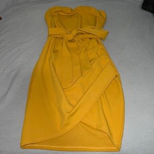 Strapless bow tie dress color is mustard yellow